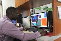 Alvin Hill, 12th Operations Support Squadron weather flight operations flight chief, checks for bat signatures on the weather radar at Joint Base San Antonio-Randolph, Texas, Aug. 20. (U.S. Air Force photo by Rich McFadden) 