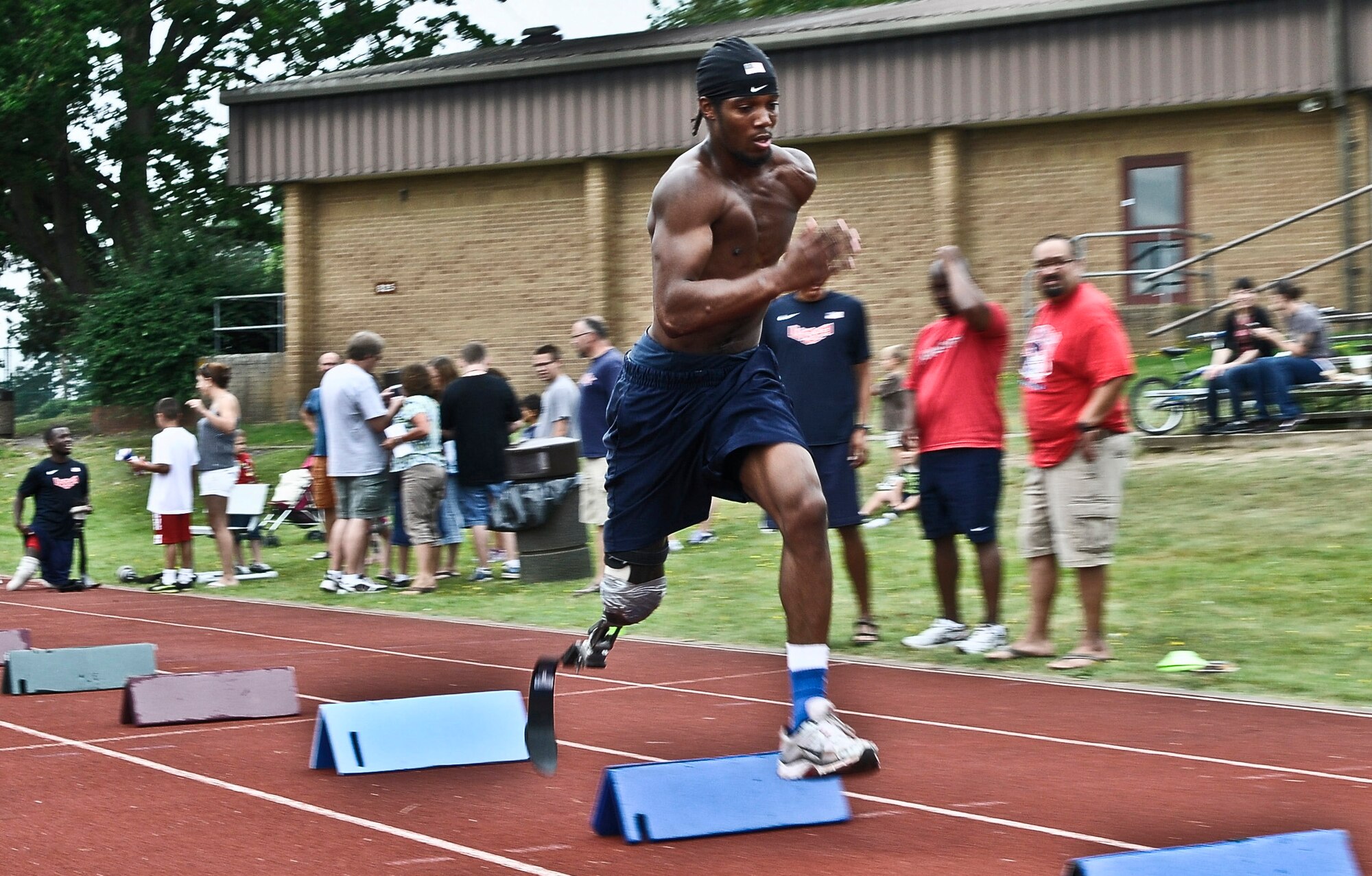 ROYAL AIR FORCE LAKENHEATH, England - Shaquille Vance, U.S. Paralympian, trains at the fitness center track Aug. 20, 2012. Vance is competing in the 100m and 200m race and the shot put.  More than 50 U.S. Paralympians and hopefuls will be honing their skills and making final preparations here Aug. 18 through 25 for competition in the London 2012 Paralympic Games. (U.S. Air Force photo by Senior Airman Connor Estes)