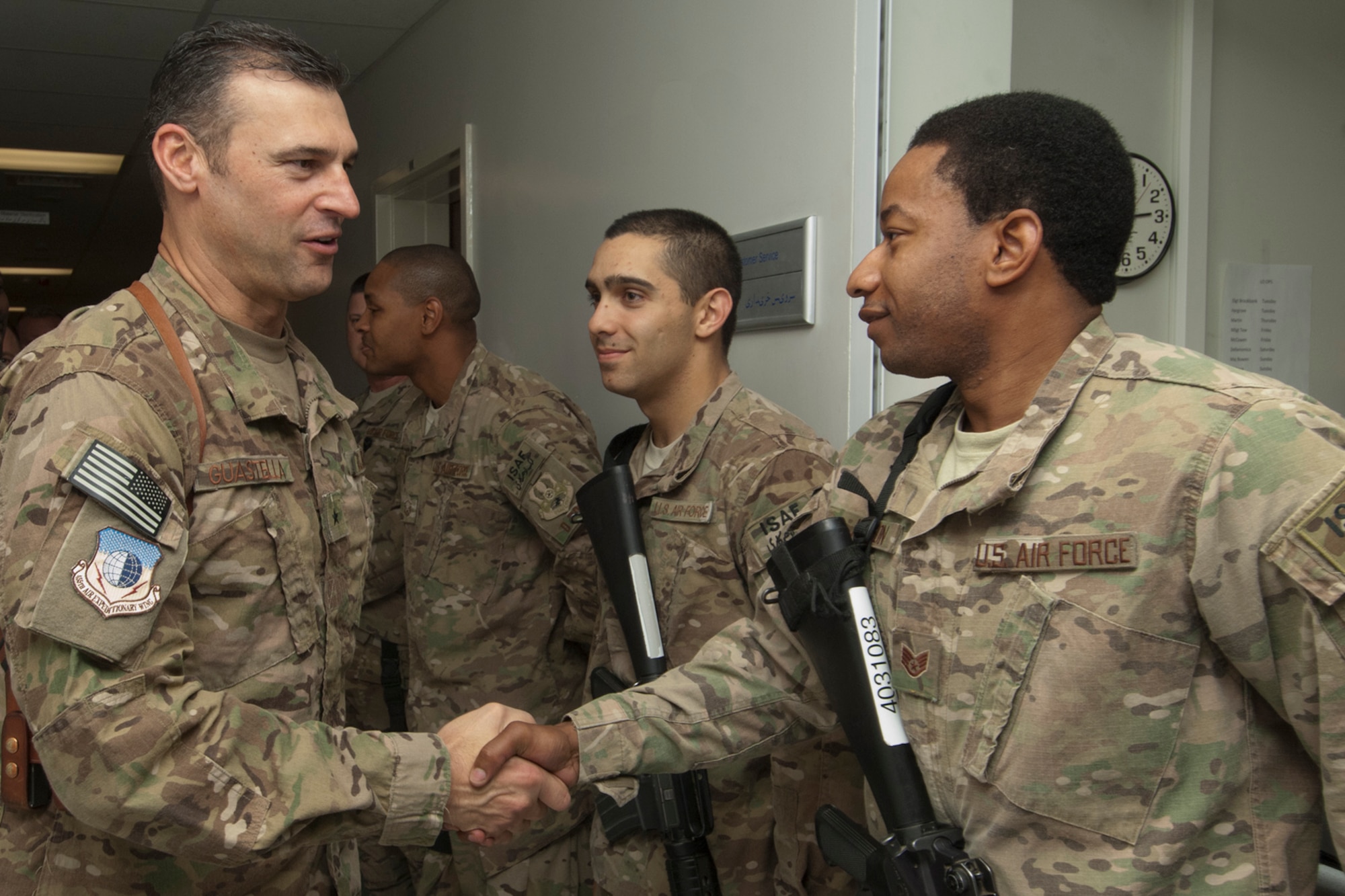 Brig. Gen. Joseph Guastella, 455th Air Expeditionary Wing commander (Left), is greeted by SSgt Delvin Johnson, NCOIC of Medical Equipment Management Office, at the Craig Joint Theater Hospital staff at Bagram Airfield Afghanistan, Aug. 20, 2012. Guastella toured the hospital to meet staff members and learn about specialized services the hospital offers. Guastella expressed his appreciation to the members of CJTH for their hard work and dedication in treating injured U.S. servicemembers, locals and coalition forces. (U.S. Air Force photo/SSgt Jeff Nevison)