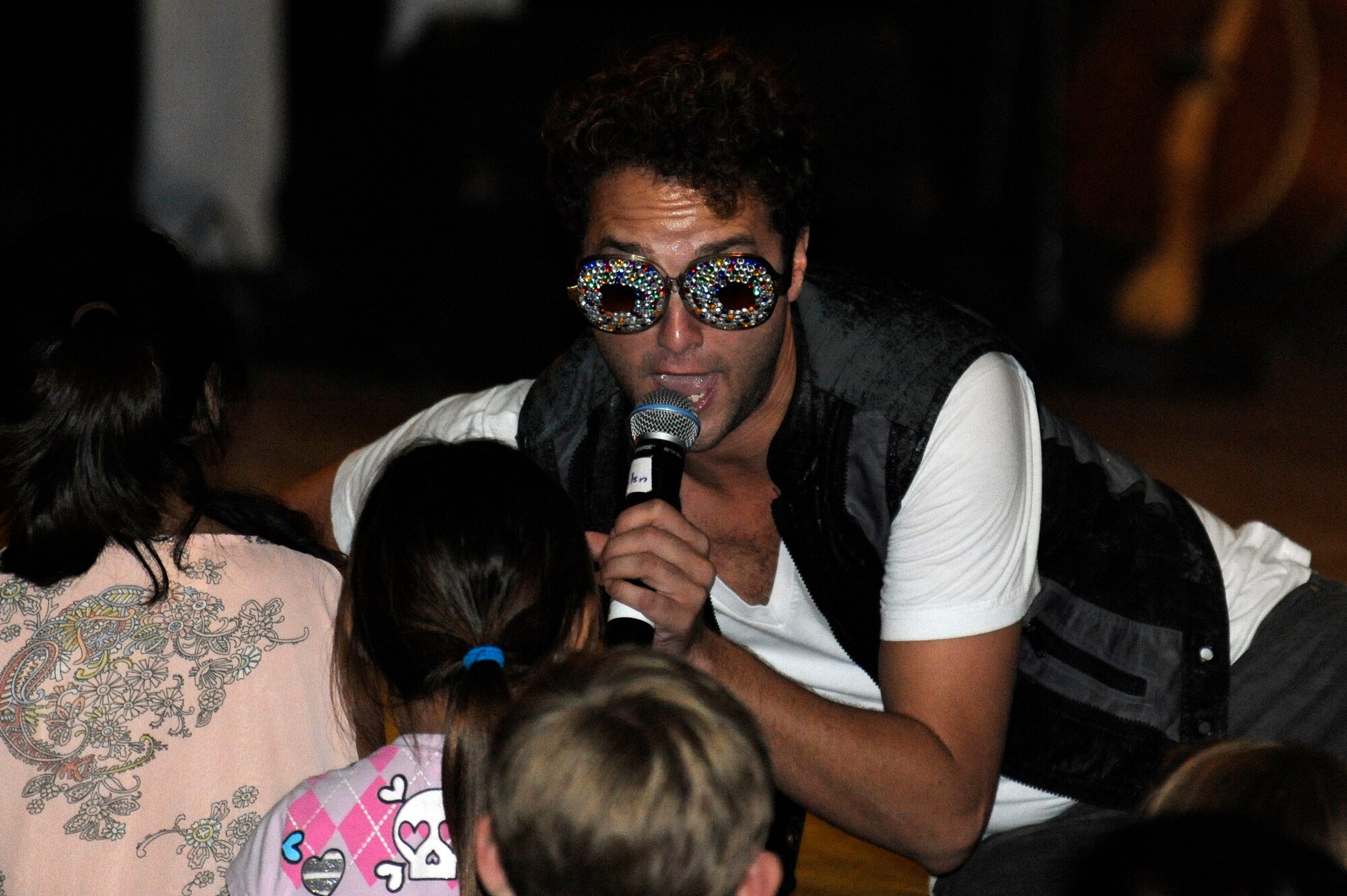 Creighton Fraker, American Idol season 11 contestant, sings to audience members during the Idols World Tour performance at the Misawa Civic Center in Misawa City, Japan, Aug. 21, 2012. Eight contestants from the past seasons of American Idol visited Misawa as part of an Armed Forces Entertainment show to sign autographs, pose for pictures and perform for military members and their families. (U.S. Air Force photo by Tech. Sgt. Marie Brown)