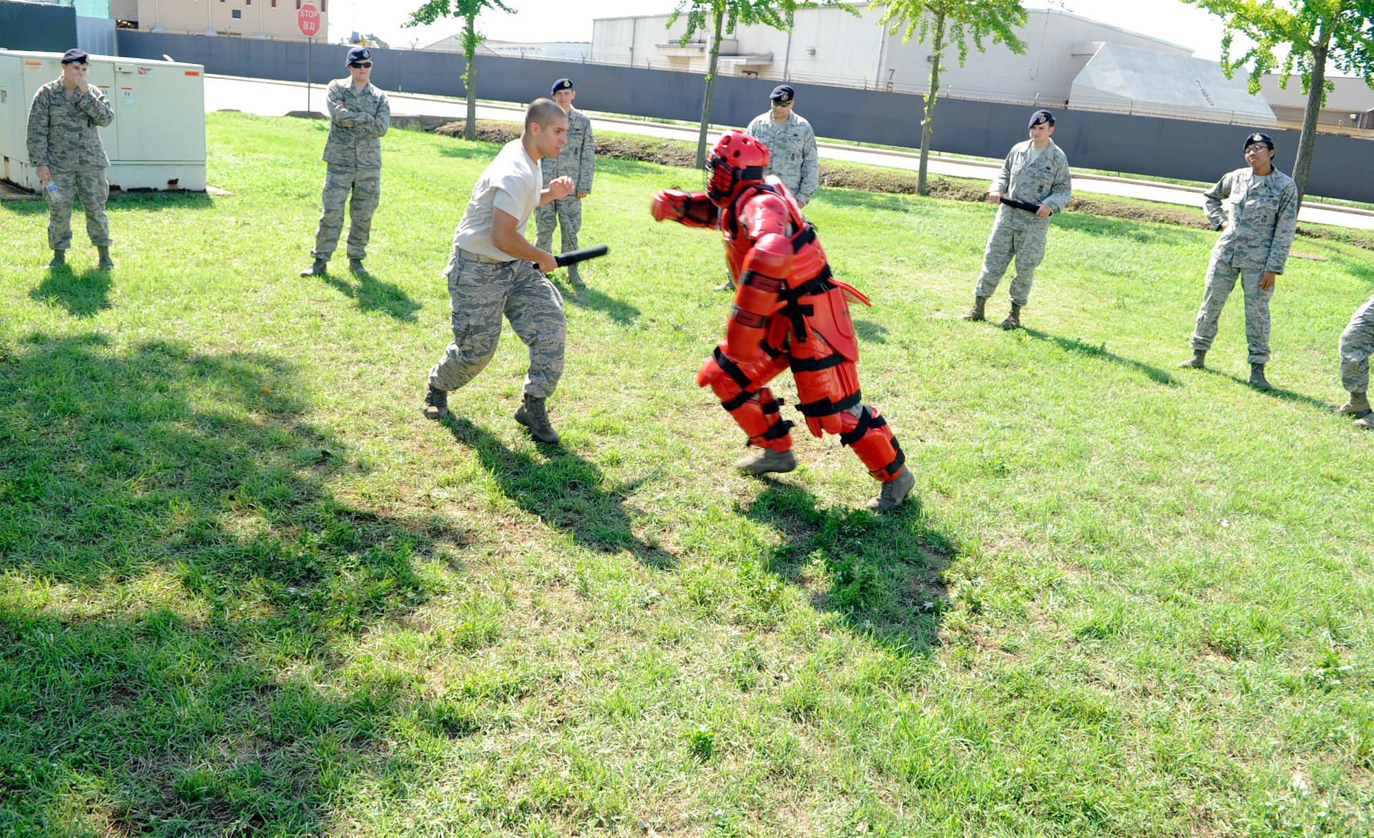 Senior Airman Travis Spears, right, charges at fellow 8th Security Forces Squadron member Airman 1st Class Warren Malcolm during expandable baton training at Kunsan Air Base, Republic of Korea, Aug. 17, 2012. Although Security Forces members are prepared to use deadly force to protect and defend, they prefer to use “less than lethal” methods to match the threat of certain situations. (U.S. Air Force photo/Senior Airman Brigitte N. Brantley)