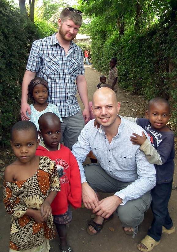 MOSHI, Tanzania — Jay Wallace, assistant counsel for the U.S. Army Corps of Engineers Middle East District (standing), with children from the Kilimanjaro Centre, an orphanage in Moshi, Tanzania. According to the Centre's website, it is registered as a non-governmental organization that provides protection and development services to orphans and street children. It houses 38 children ranging in age from 3 to 14, and provides them with an education. The Centre is supported through donations, grants, contributions and sponsorships from individuals and companies. Wallace said his tour group was also associated with the Centre. Wallace said this portion of the trip may have been the most memorable.