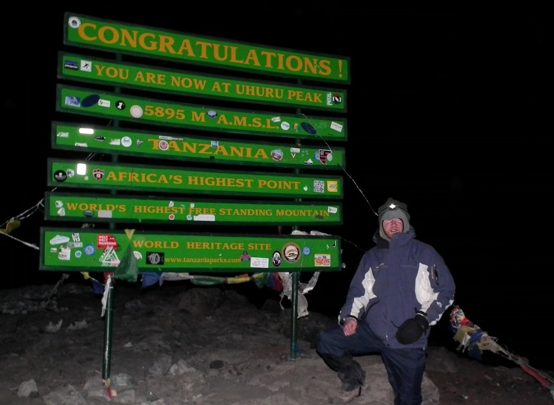 TANANIA — Jay Wallace, assistant counsel for the U.S. Army Corps of Engineers Middle East District, stands at Uhuru Peak, the highest point of Kilimanjaro, just before sunrise.