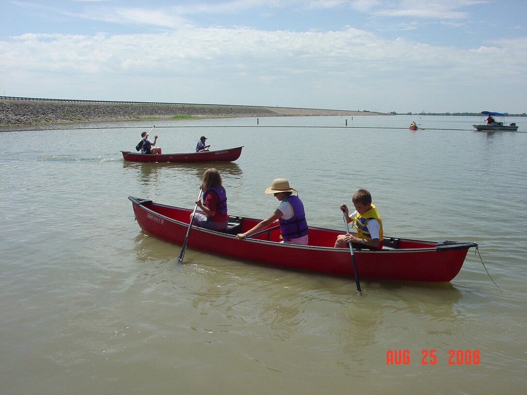 Kids learning to canoe