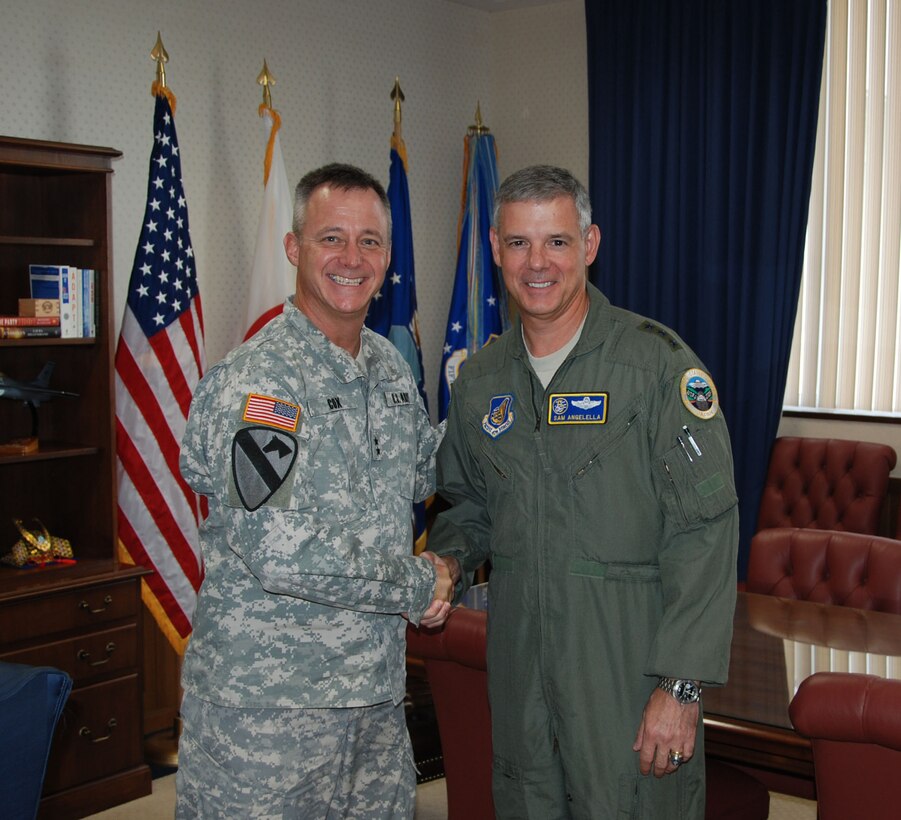 Maj. Gen. Kendall P. Cox, Deputy Commanding General for Military and International Operations, U.S. Army Corps of Engineers is greeted by Lt. Gen. Salvatore A. Angelella, Commander, U.S. Forces, Japan and 5th Air Force Aug. 17 at Yokota Air Base, Japan.  Both commands help build security and stability in the Pacific.   (Official USACE photo by T.W. Lyman)