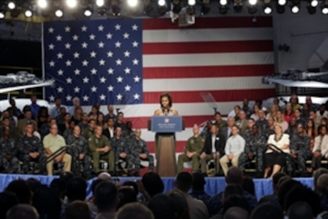 First Lady Michelle Obama announces a major military employment milestone during a "Joining Forces" event on Naval Station Mayport in Jacksonville, Fla., Aug. 22, 2012, reporting that more than 2,000 companies have hired 125,000 veterans and spouses through the campaign.