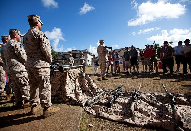 U.S. Marine Gunner and Chief Warrant Officer 3 James Law (center), the 3rd Marine Regiment gunner and a native of Portland, Ore., showcases the unit’s newest weaponry to a crowd of Vietnam veterans from 2nd Battalion, 3rd Marine Regiment, and their families during a visit to Marine Corps Base Hawaii, Aug. 22, 2012. Nearly half a century since they fought through hell in Vietnam, approximately 30 former 2/3 Marines and their families visited the base to reminisce on their service and render honor to a brother lost in combat, Sgt. Maj. Wayne Hayes. Hayes was killed in action, Feb. 28, 1967, during Operation Prairie II while serving with many of the 2/3 veterans.