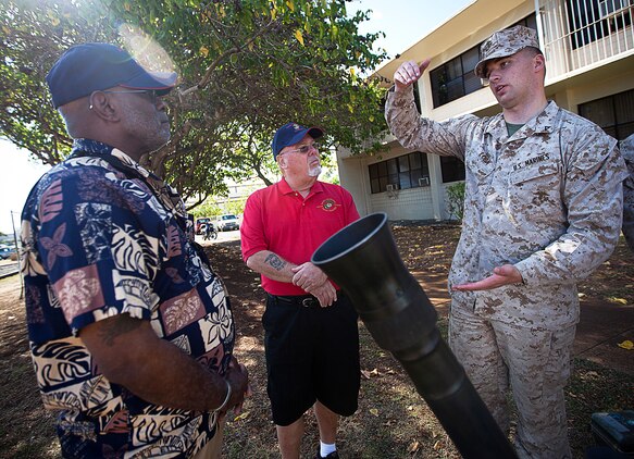 U.S. Marine Lance Cpl. Stefan Loga, a mortarman with Weapons Company, 2nd Battalion, 3rd Marine Regiment, and 22-year-old native of Hot Springs, Ark., explains firing procedures for an 81mm mortar to former Sgt. Alvin Thompson and Tom Householder, Vietnam veterans who served in 2/3, during their visit to Marine Corps Base Hawaii, Aug. 22, 2012. Nearly half a century since they fought through hell in Vietnam, approximately 30 former 2/3 Marines and their families visited the base to reminisce on their service and render honor to a brother lost in combat, Sgt. Maj. Wayne Hayes. Hayes was killed in action, Feb. 28, 1967, during Operation Prairie II while serving with many of the 2/3 veterans.