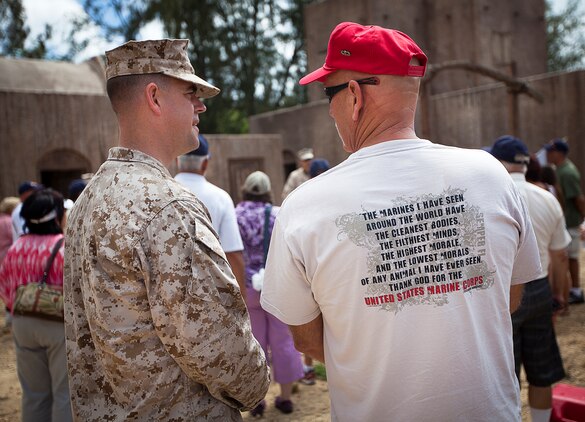 Former U.S. Marine Sgt. Dave Smith (right), a Vietnam veteran who served with Fox Company, 2nd Battalion, 3rd Marine Regiment, speaks with Gunnery Sgt. Tommy Vaughn, an infantry unit leader with 2/3, while viewing a military operations in urban terrain (MOUT) training facility during a visit to Marine Corps Training Area Bellows, Hawaii, Aug. 22, 2012. Smith, a native of Santa Ynez, Calif., served in Vietnam as a mortarman from 1967-1968. Nearly half a century since they fought through hell in Vietnam, approximately 30 former 2/3 Marines and their families visited the base to reminisce on their service and render honor to a brother lost in combat, Sgt. Maj. Wayne Hayes. Hayes was killed in action, Feb. 28, 1967, during Operation Prairie II while serving with many of the 2/3 veterans.