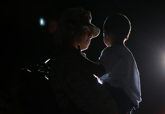 Sgt. Felipe Perezrobles holds his son Miguel for the first time in seven months after returning from a deployment to Afghanistan Aug. 19 at Camp Foster, Okinawa, Japan. Perezrobles is a motor vehicle operator with Combat Logistics Battalion 4, Combat Logistics Regiment 3, 3rd Marine Logistics Group, III Marine Expeditionary Force.

 
 

