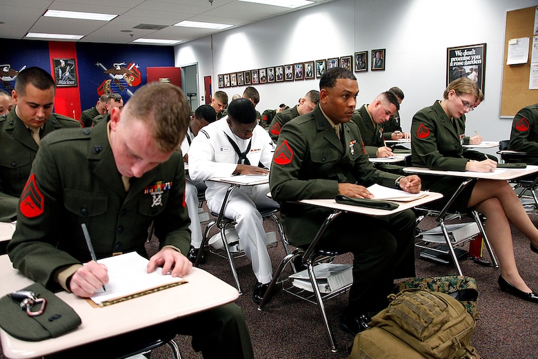 Marines with Cherry Point Corporals Leadership Course Class 274-12 fill out paperwork after checking into the course at the Training and Education Center, Aug. 13. The three-week course is the first Professional Military Education class enlisted Marines attend and focuses on leadership, history and tradition of Marine Corps corporals.