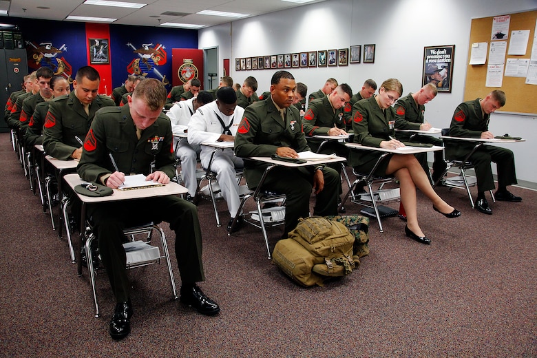 Marines with Cherry Point Corporals Leadership Course Class 274-12 fill out paperwork after checking into the course at the Training and Education Center, Aug. 13. The three-week course is the first Professional Military Education class enlisted Marines attend and focuses on leadership, history and tradition of Marine Corps corporals.