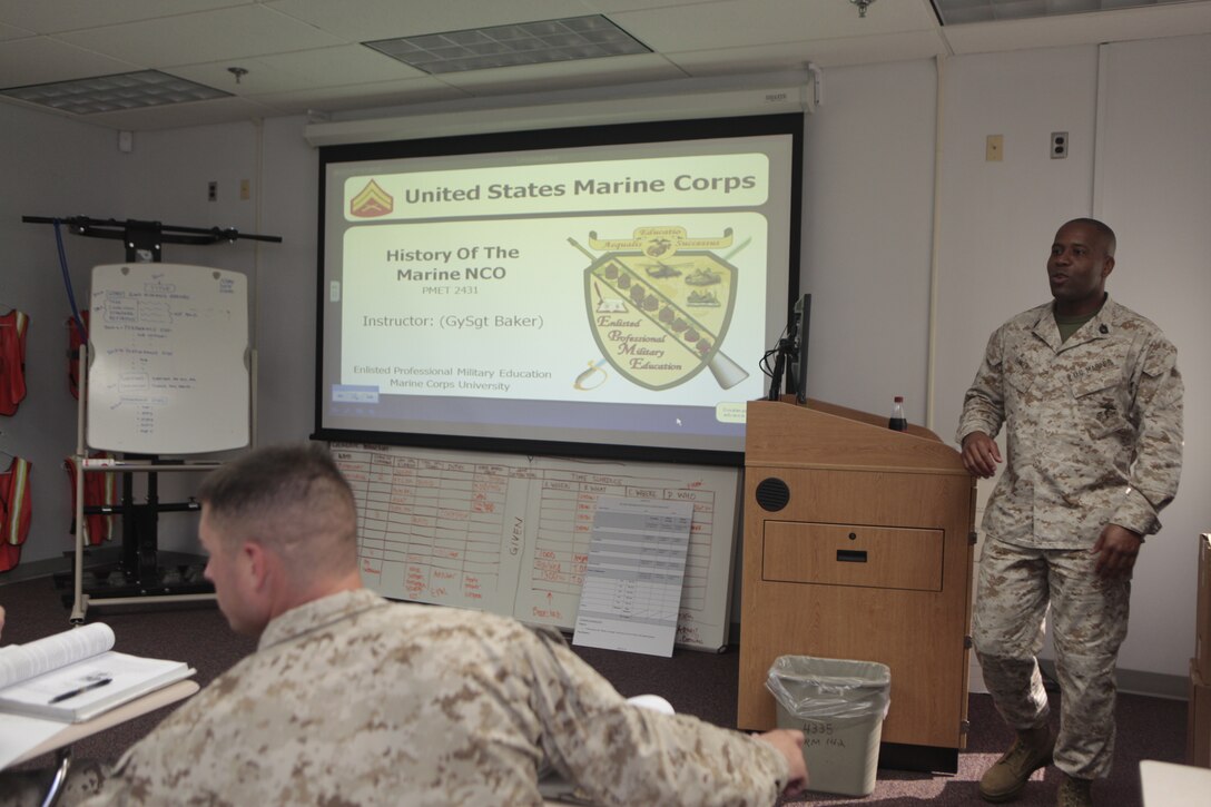 Gunnery Sgt. Valdez R. Baker, staff non commissioned officer in charge for Cherry Point Corporals Leadership Course, teaches a history of the NCO class at the Training and Education Center, Aug. 16. "We are directly responsible for shaping the ideas they have," said Baker about his responsibilities to the corporals that come through his course. "Going to basic training, (Marine Combat Training), (military occupations skills) school, that’s just the foundation."