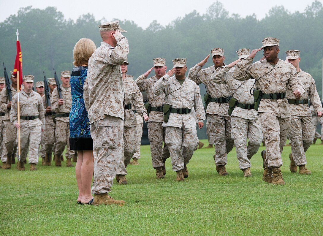 Col. Brent Goddard, chief of staff, Marine Corps Logistics Command, salutes the staff as they lead a pass and review during a ceremony held at Marine Corps Logistics Base Albany, Aug. 3. Goddard retired after serving 34 years.