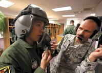 U.S. Air Force Academy Cadet 2nd Class Anthony R. Riel, class of 2014, is fitted with a flight helmet by Master Sgt. Fred Wenzlaff, aircrew flight equipment technician, 182nd Fighter Squadron, July 24. Riel is one of six cadets who received egress training and flight time on an F-16 flight simulator at the 149th Fighter Wing. The cadets arrived at Joint Base San Antonio-Lackland July 16 to participate in Operation Air Force. The program sends groups of academy cadets to Air Force bases for three weeks, where they shadow active-duty Airmen in different fields to gain an understanding of career responsibilities and knowledge of daily Air Force operations, and to interact with enlisted members. (U.S. Air Force photo/Robbin Cresswell)
