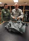 U.S. Air Force Academy Cadet 2nd Class Anthony R. Riel, class of 2014, is fitted for a flight suit by Master Sgt. Fred Wenzlaff, aircrew flight equipment technician, 182nd Fighter Squadron, July 24. Riel is one of six cadets who received egress training and flight time on an F-16 flight simulator at the 149th Fighter Wing. (U.S. Air Force photo/Robbin Cresswell)
