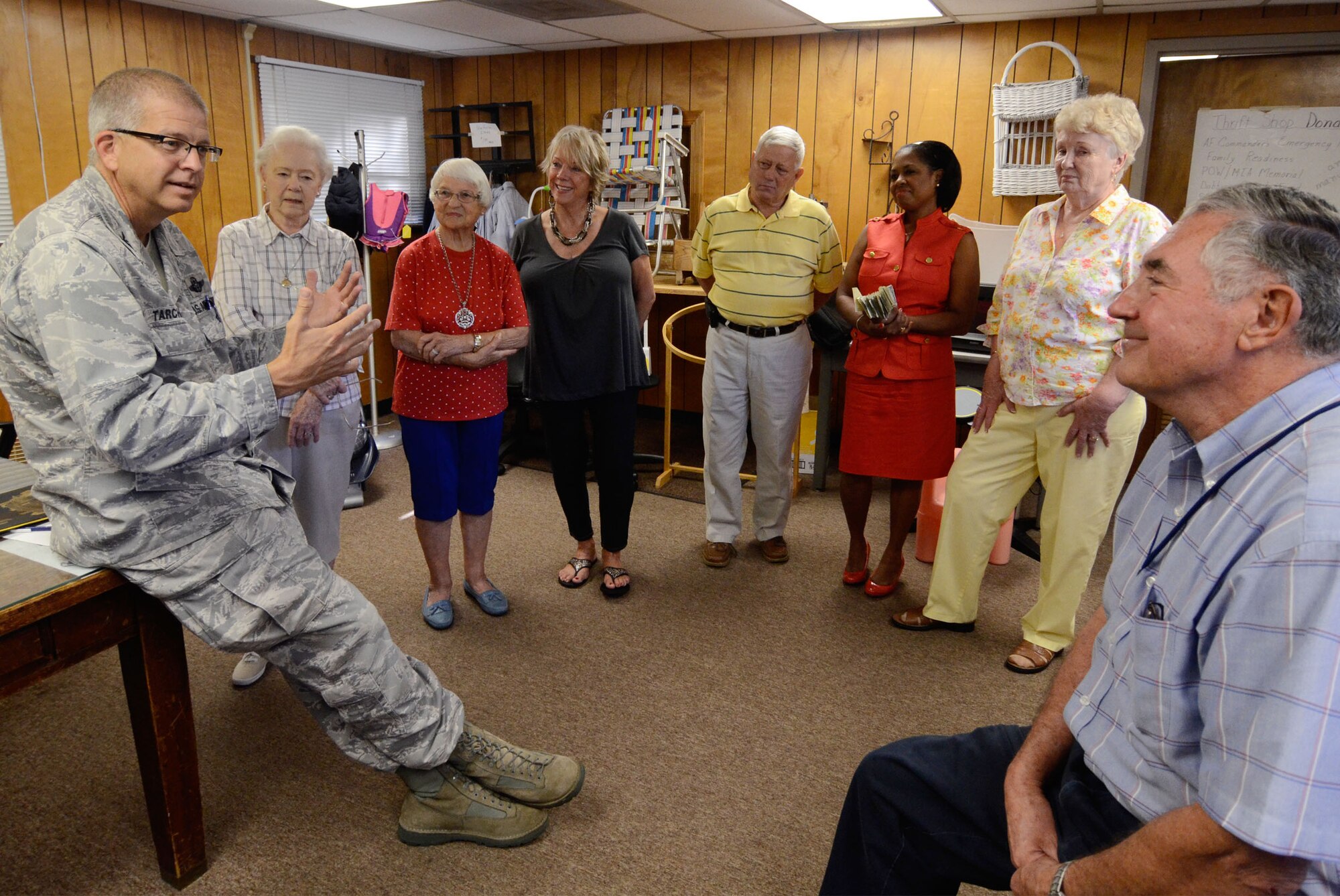 Col. Tim Tarchick, 94th Airlift Wing commander thanks volunteers from the Dobbins Thrift Store, 94th Airlift Wing Safety, and the 94th Logistics Readiness Squadron after a presentation to Angela Pedersen, Director of the Airmen Family Readiness section of cash and a check totaling $1,613 Aug. 23. The funds raised from proceeds from the Corn and Sausage Roast held earlier this year and from sales at the thrift store, will be used to provide Airmen with emergency financial assistance.  (U.S. Air Force photo/Don Peek)