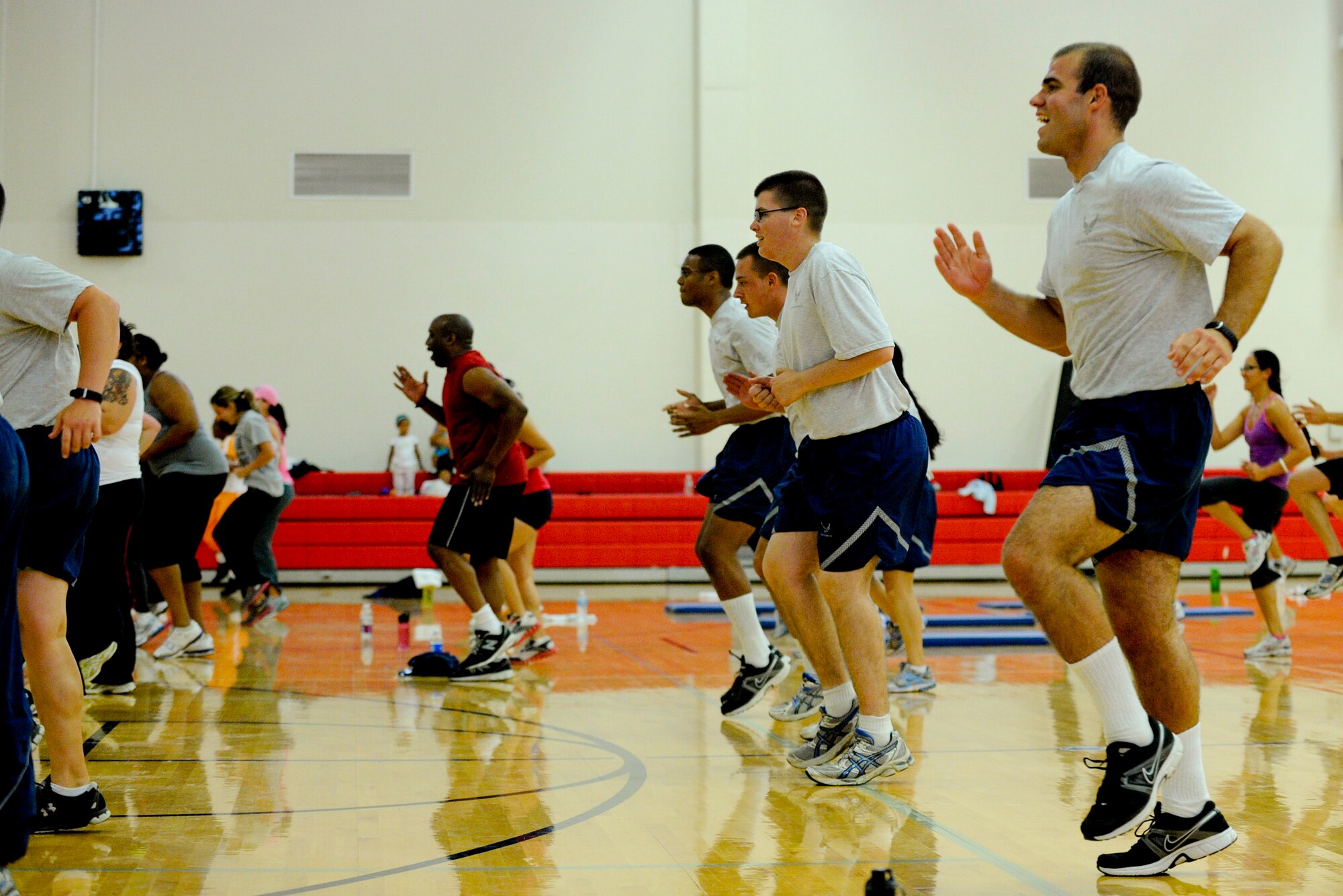 VANDENBERG AIR FORCE BASE, Calif. – Team V Airmen “bring it” during a fitness class taught by P90X fitness guru Tony Horton at the fitness center here Wednesday, August 22, 2012. Horton and his training crew have teamed up with Armed Forces Entertainment for the “Ripped and Ready” tour of American military installations worldwide.  (U.S. Air Force photo/ Staff Sgt. Levi Riendeau)