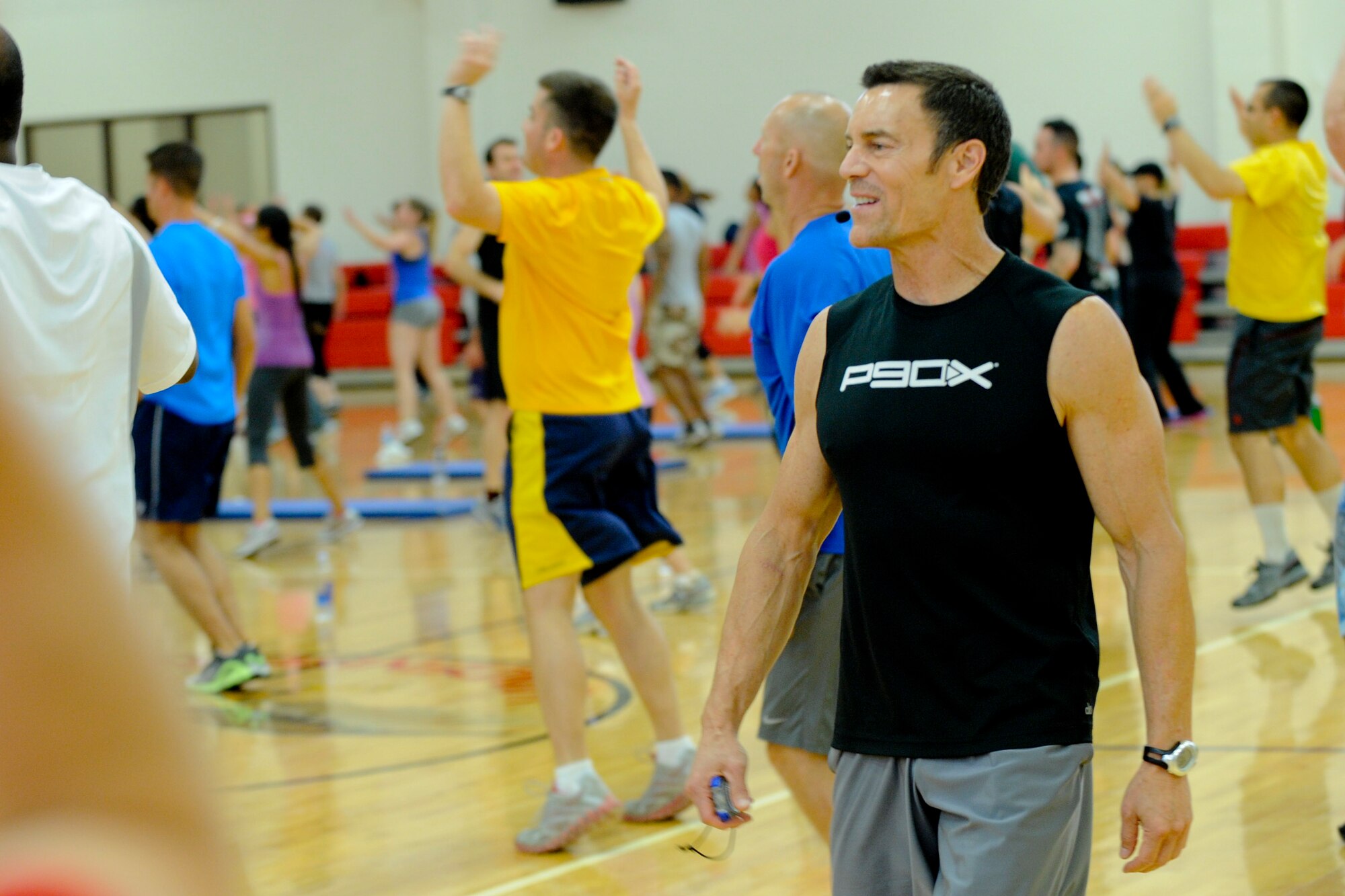VANDENBERG AIR FORCE BASE, Calif. – Tony Horton, fitness celebrity and the creator of P90X, leads Airmen during a special event at the fitness center here Wednesday, August 22, 2012.  Horton and his training crew have teamed up with Armed Forces Entertainment for the “Ripped and Ready” tour of American military installations worldwide.  (U.S. Air Force photo/ Staff Sgt. Levi Riendeau)
