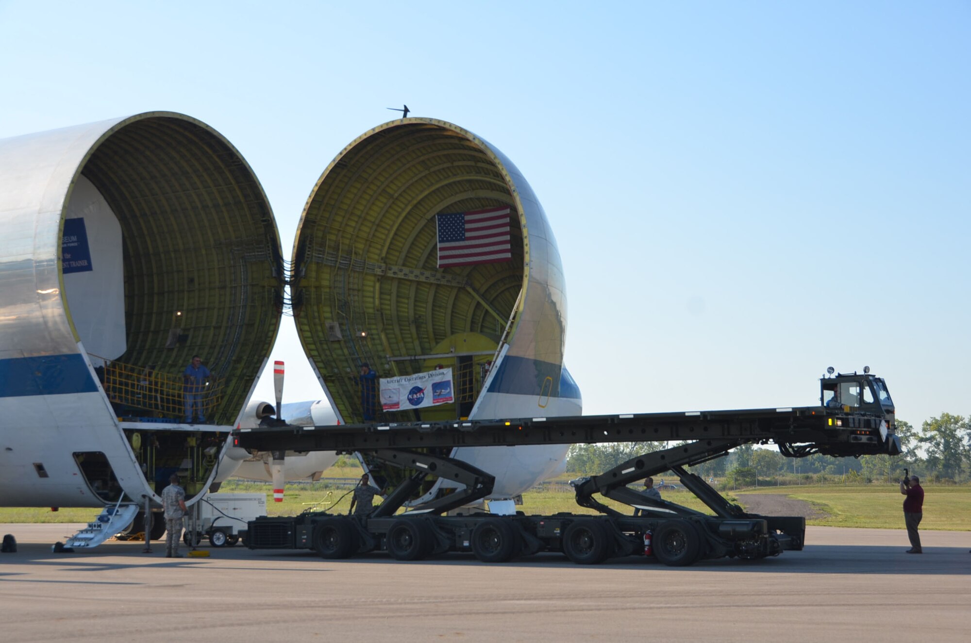 WRIGHT-PATTERSON AIR FORCE BASE, Ohio –Twelve Airmen from the 87th Aerial Port Squadron with the help of NASA loadmasters unload the first Shuttle Crew Compartment Trainer from NASA’s Super Guppy aircraft Aug. 23.  With the help of the National Museum of the United States Air Force restoration specialists, the CCT-1 was moved from the Super Guppy to the museum’s Cold War Gallery where its interior will be reassembled then put on display for the general public when it is moved to a new Space Gallery in the museum’s planned fourth building. (U.S. Air Force photo/Lt. Col. Cynthia Harris)