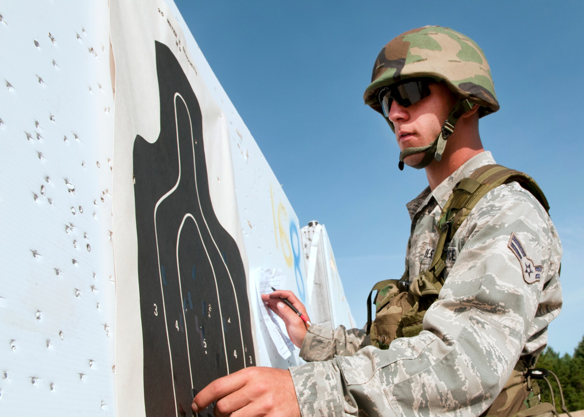 FORT DEVENS, Mass. -- Airman 1st Class Don Boyer checks the scores of another competitor during the state Combat Marksmanship Competition here Aug. 19. More than 70 members of the New Hampshire National Guard competed in the annual event with winners moving on to the New England Warrior Challenge, The National Guard Marksmanship Advisory Council Region 1 Regional Competition in September. (U.S. Air Force photo by Tech. Sgt. Mark Wyatt)