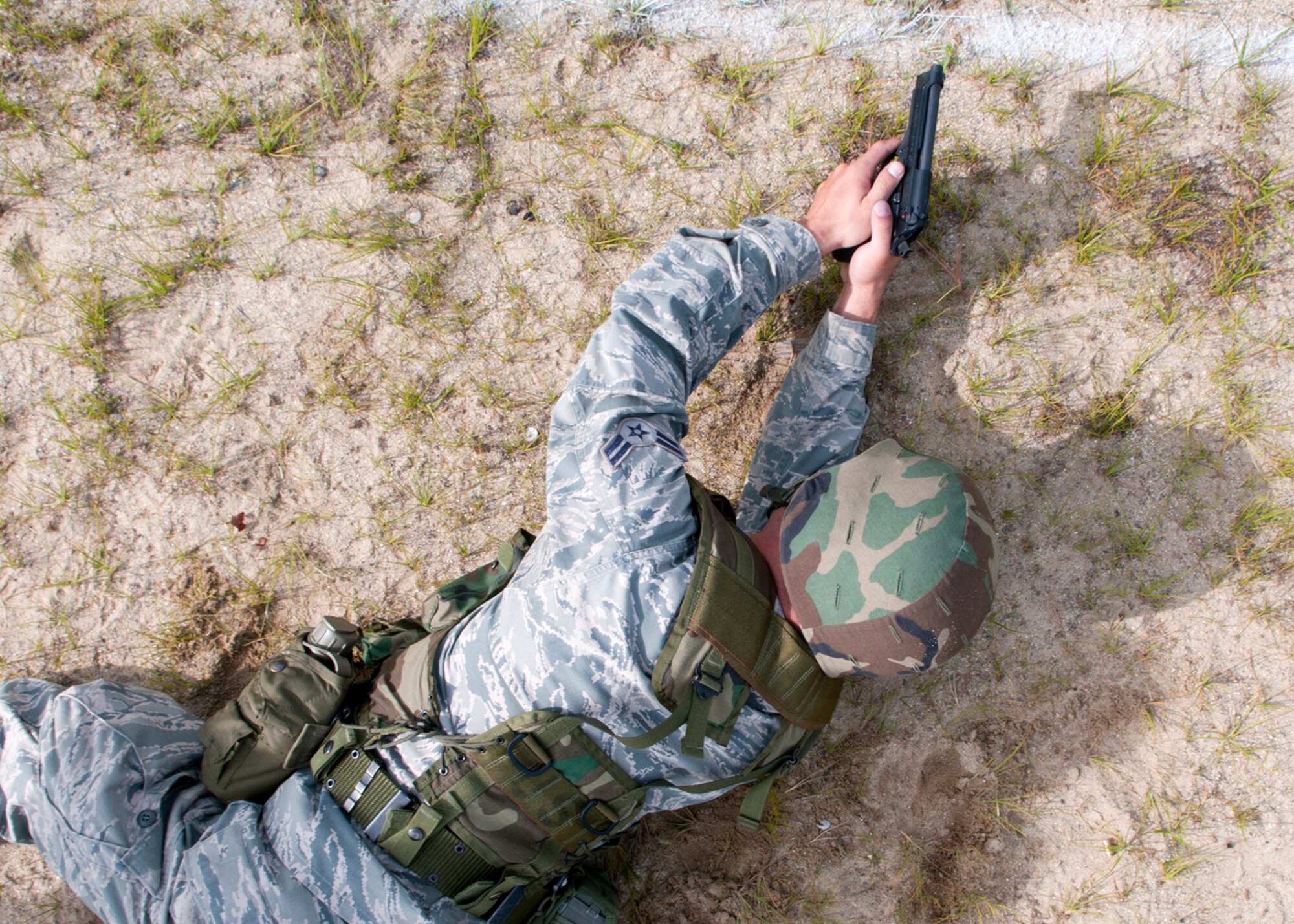 FORT DEVENS, Mass. -- Airman 1st Class Don Boyer, 157th Maintenance Squadron, shoots the M-9 pistol during the state Combat Marksmanship Competition here Aug. 19. More than 70 members of the New Hampshire National Guard competed in the annual event with winners moving on to the New England Warrior Challenge, The National Guard Marksmanship Advisory Council Region 1 Regional Competition in September. (U.S. Air Force photo by Tech. Sgt. Mark Wyatt)