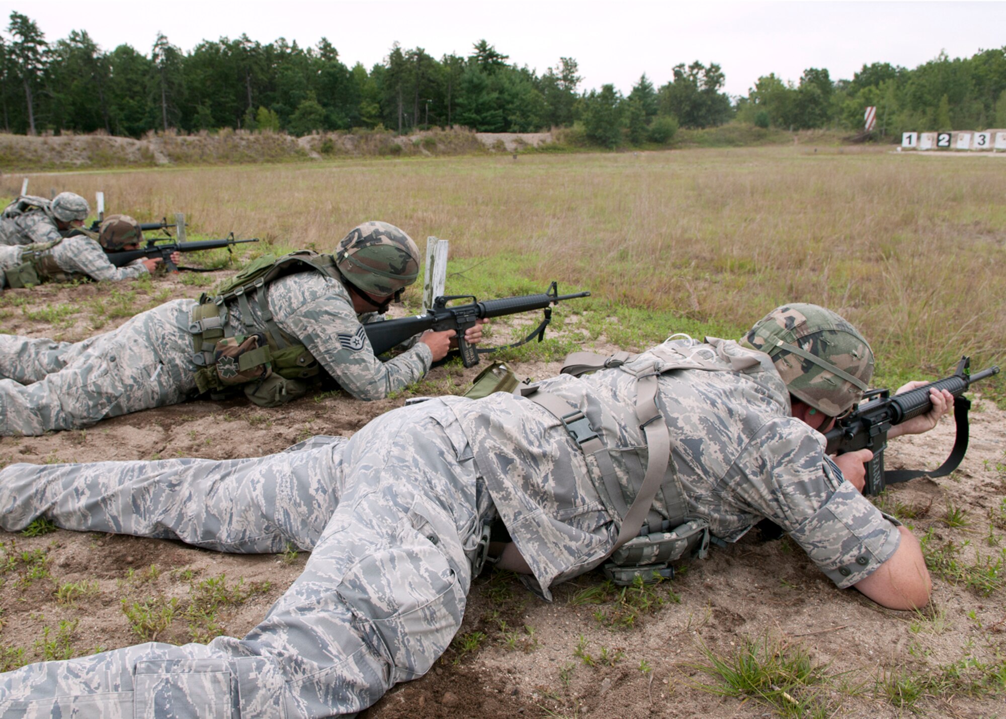 FORT DEVENS, Mass. -- Members of the New Hampshire Air National Guard compete during the state Combat Marksmanship Competition here Aug. 19. (left to right) Master Sgt. Brian Dulin, Airman 1st Class Don Boyer, Staff Sgt. Chris Gray and Master Sgt. Michael Bane fire their weapons during the final competition of the day. All together, more than 70 members of the New Hampshire National Guard competed in the annual event with winners moving on to the New England Warrior Challenge, The National Guard Marksmanship Advisory Council Region 1 Regional Competition in September. (U.S. Air Force photo by Tech. Sgt. Mark Wyatt)