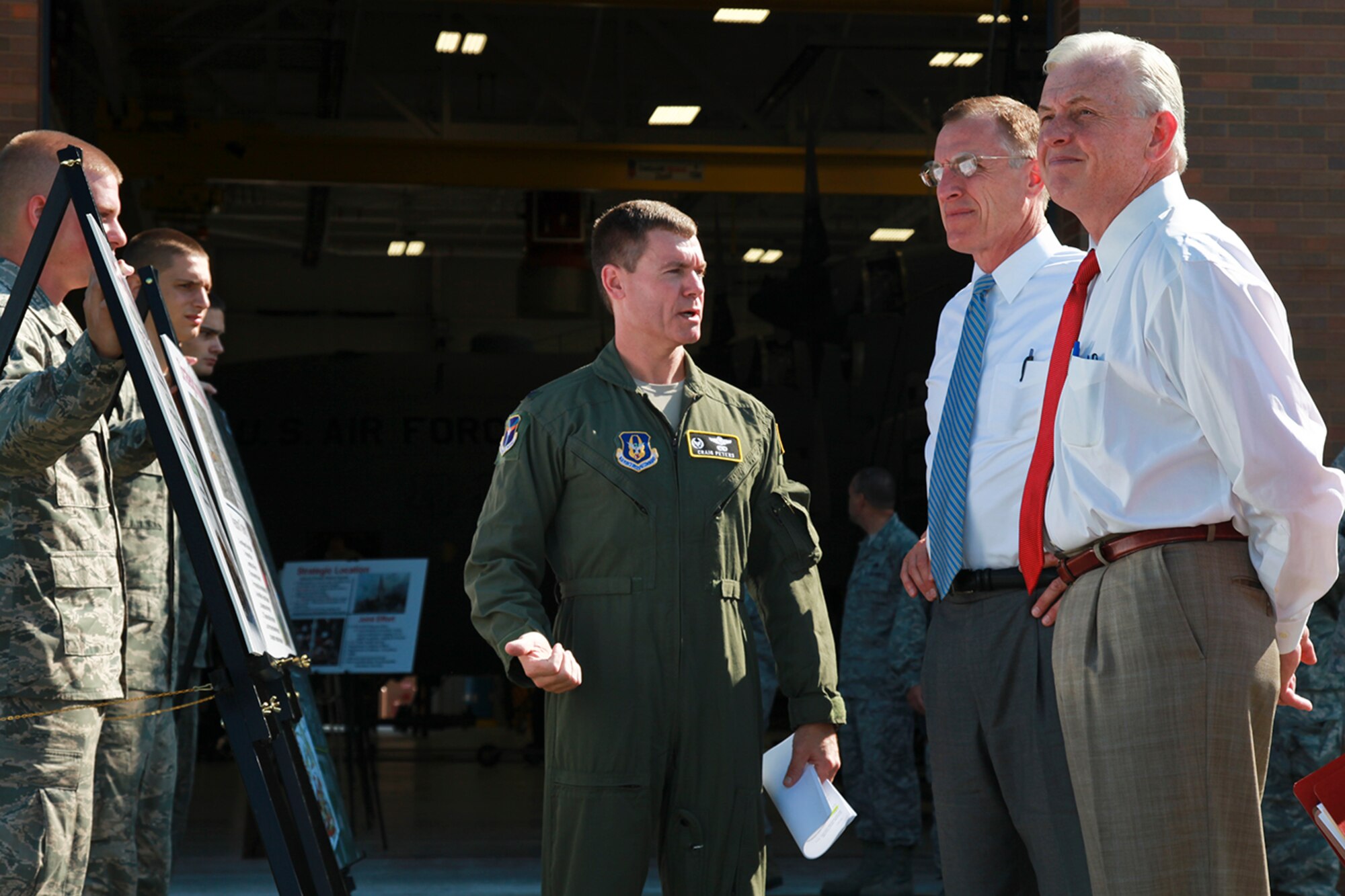 Col. Craig Peters (center), 911th Airlift Wing commander, briefs Rep. Tim Murphy (R-18) and Pennsylvania State Auditor General Jack Wagner on the mission, strategic location and the economic impact the Air Reserve Base has in the communities surrounding the City of Pittsburgh.  One of the many topics discussed during this tour, Aug. 22, 2012 was the significant role of the 911 AW during a possible national disaster, in which the 911th is capable of receiving, staging and transporting more than 800 patients in an 8-hour period. (U.S. Air Force photo by Tech. Sgt. Ralph Van Houtem/Released