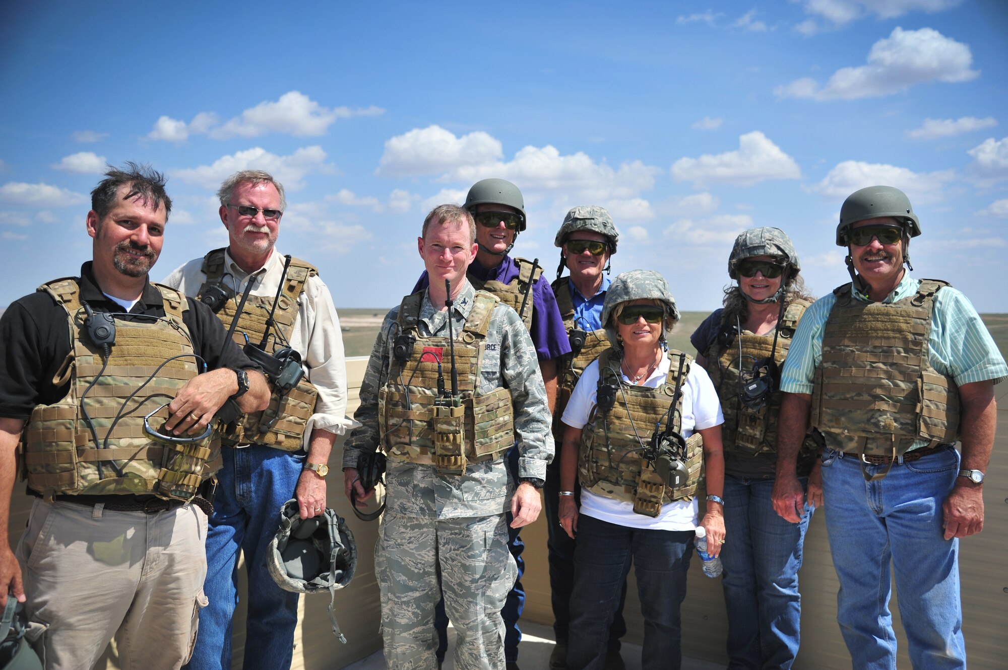 U.S. Air Force Col. William West, 27th Special Operations Group commander, and Rick Masters, 27th Special Operations Wing director of staff, stand with Cannon's honorary commanders at Melrose Air Force Range, N.M., Aug. 22, 2012. The 27 SOW Honorary Command Program is geared toward fostering military pride and local support from a broad group of surrounding community ambassadors.  (U.S. Air Force photo/Airman 1st Class Alexxis Pons Abascal)  