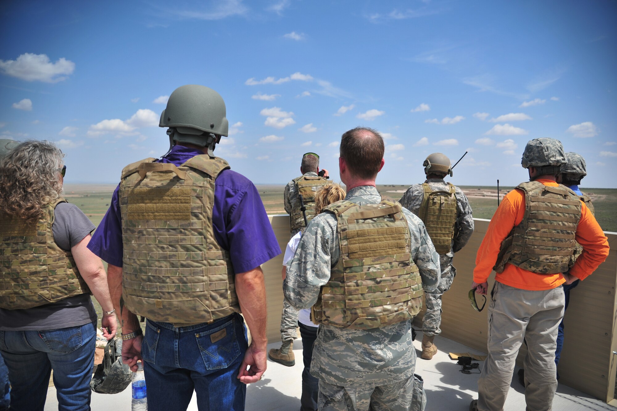 U.S. Air Force Col. William West, 27th Special Operations Group commander, stands with Cannon's honorary commanders as they observe air-to-ground firing on designated targets at Melrose Air Force Range, N.M., Aug. 22, 2012. The 27th Special Operations Wing Honorary Command Program is geared toward fostering military pride and local support from a broad group of surrounding community ambassadors.  (U.S. Air Force photo/Airman 1st Class Alexxis Pons Abascal)  