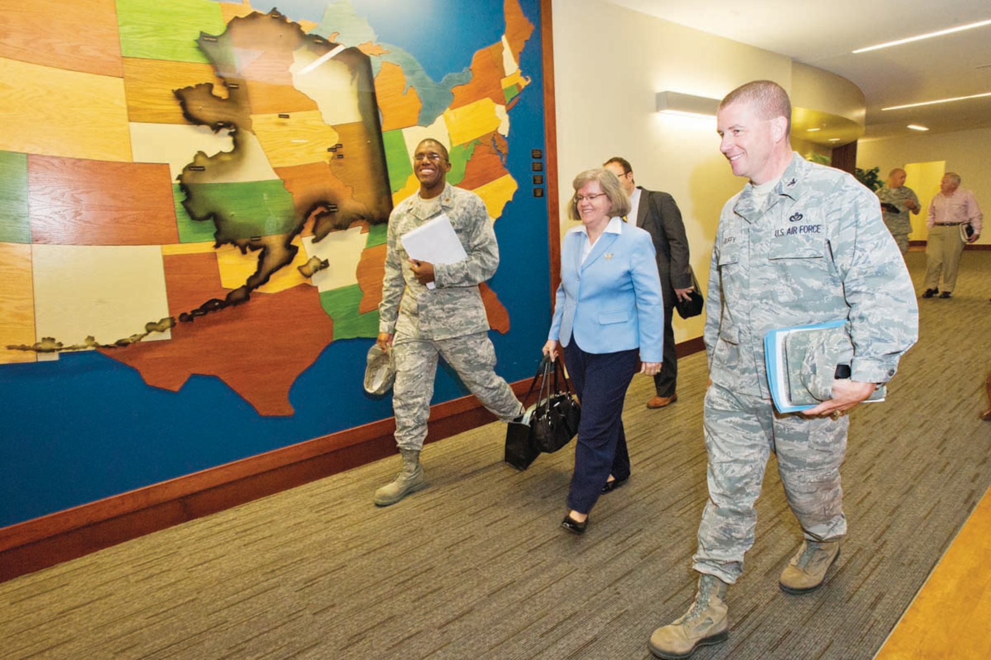 Holly Petraeus, assistant director for Servicemember Affairs for the Consumer Financial Protection Bureau, walks with Air Force Col. Brian Duffy, 673d Air Base Wing and installation commander, at JBER, Wednesday.  Petraeus visited to talk about the newly created bureau’s mission to educate about and protect military service members and families from fraud.  (U.S. Air Force photo by Justin Connaher)