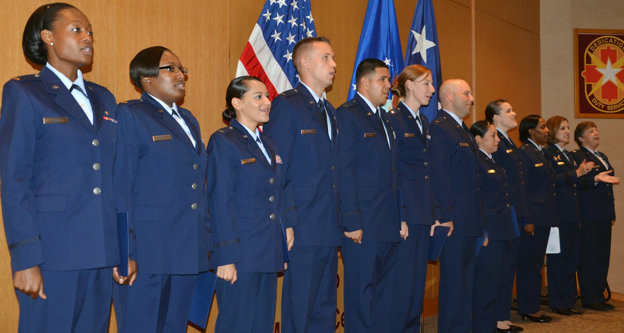 The first class of 12 Air Force nursing residents participate in a graduation ceremony Aug. 20 at the San Antonio Military Medical Center. (Photo by Lori Newman, JBSA-Fort Sam Houston Public Affairs)