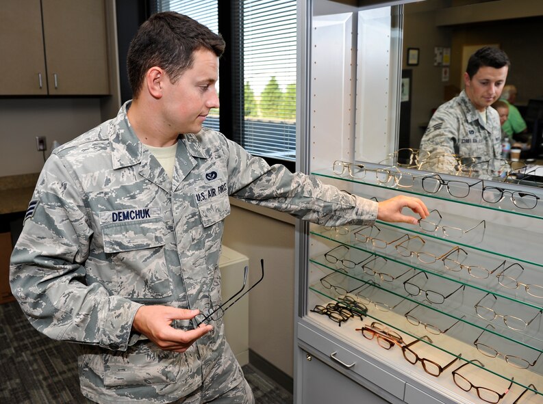 Senior Airman Ilya Demchuk, 92nd Civil Engineer Squadron heating, ventilation, air conditioning and refrigeration technician, browses for his “frames of choice” after completing his eye examination in the base optometry clinic at Fairchild Air Force Base, Wash., Aug. 22, 2012. Optometry exams are available to U.S. servicemembers annually as part of the health care service they are provided. (U.S. Air Force photo by Senior Airman Benjamin Stratton)