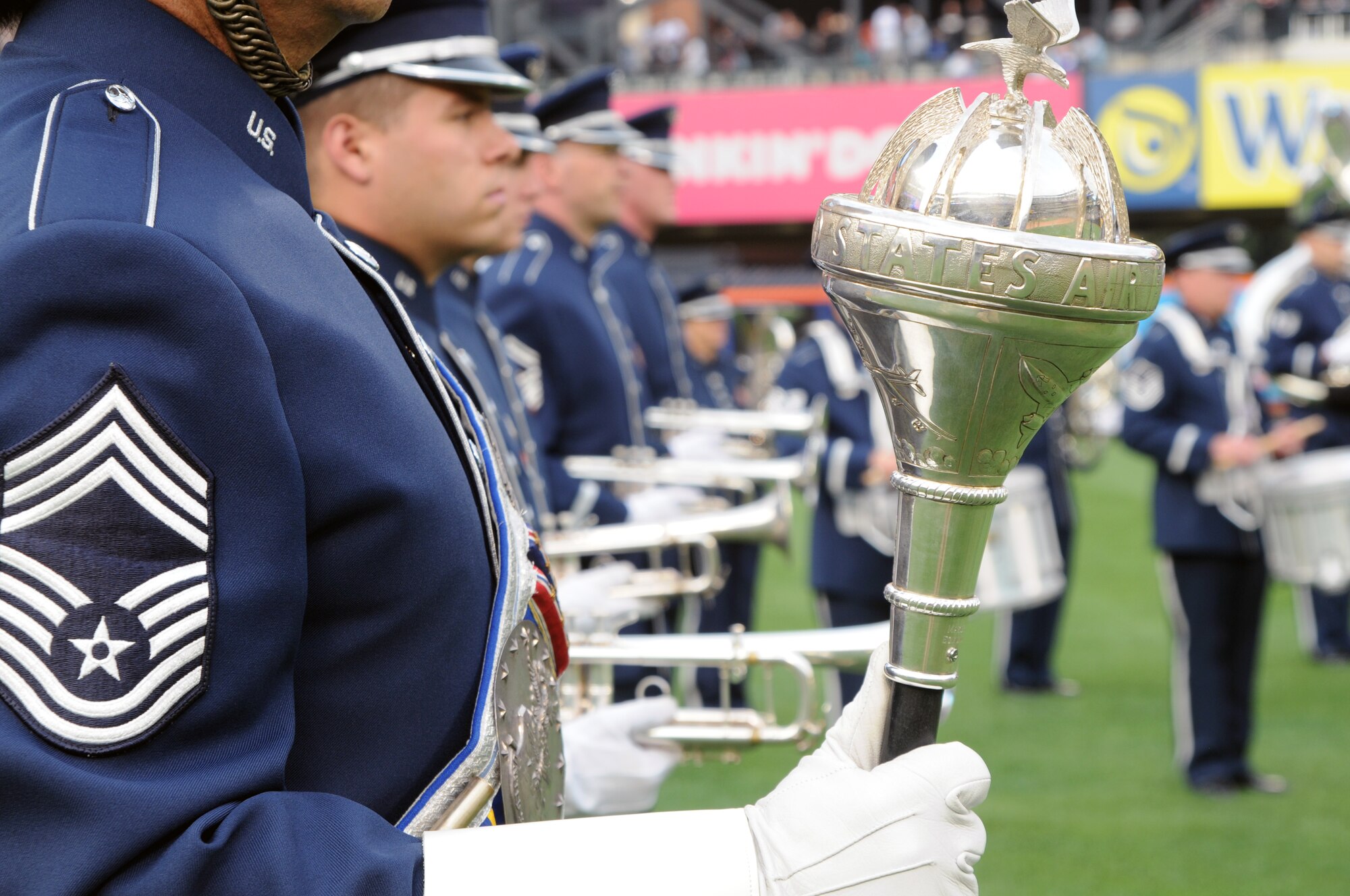 Chief Master Sgt. Edward Teleky, U.S. Air Force Band's Ceremonial Brass drum major, accompanies his unit on Citi Field Aug. 20 for the opening of the New York Mets game, Queens, N.Y. The Ceremonial Brass opened for the Mets during the Air Force Week celebration. (U.S. Air Force photo by Senior Airman Tabitha N. Haynes)           