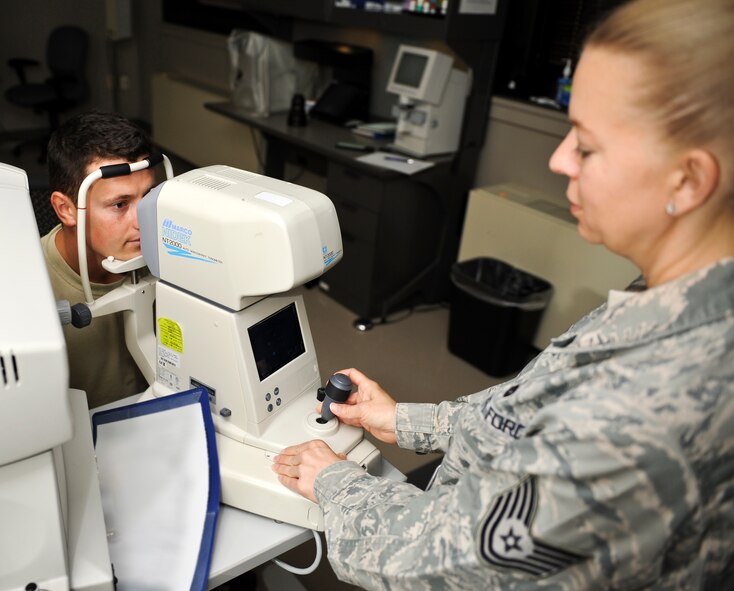 Tech. Sgt. Paula Barkhauer, 92nd Aerospace Medicine Squadron optometry NCO in charge, uses a machine designed to check eye pressure on Senior Airman Ilya Demchuk, 92nd Civil Engineer Squadron heating, ventilation, air conditioning and refrigeration technician, as an essential step of his eye exam in the base optometry clinic at Fairchild Air Force Base, Wash., Aug. 22, 2012. The “puff of air” checks the patient’s eyes for signs of glaucoma by putting pressure on the optic nerver. Glaucoma is a disease known for causing blindness. (U.S. Air Force photo by Senior Airman Benjamin Stratton)