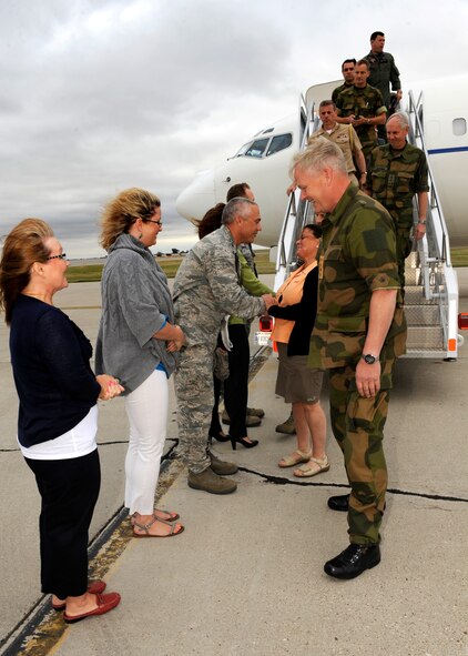 MINOT AIR FORCE BASE, N.D. -- General Harald Sunde, Chief of Defense of Norway, and his wife Mrs. Solvi Sunde are greeted by Col. James Dawkins Jr., 5th Bomb Wing commander; Col. Robert Vercher, 91st Missile Wing commander, and their spouses here, Aug.15. Sunde had a firsthand look at both the 5th BW and 91st MW deterrence missions. (U.S. Air Force photo/Airman 1st Class Stephanie Ashley)