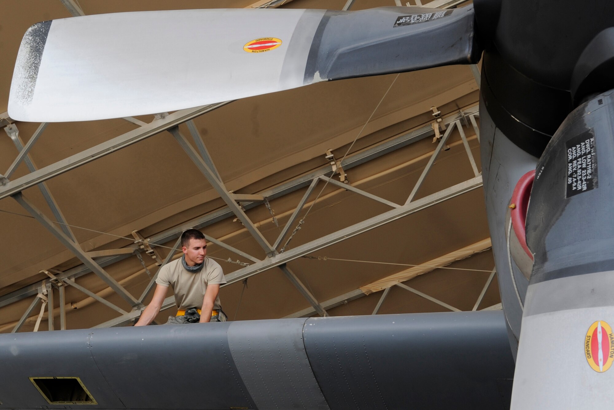 SOUTHWEST ASIA - Airman First Class John Cirincione, 386th Expeditionary Maintenance Squadron crew chief, repairs panels on a C-130 here Aug. 17. A crew chief's mission is to keep the aircraft flying. They secure, inspect and service the aircraft after it lands and before its next flight. Cirincione is the 386th Air Expeditionary Wing's Rock Solid Warrior. (U.S. Air Force photo/Staff Sgt. Alexandra M. Boutte)