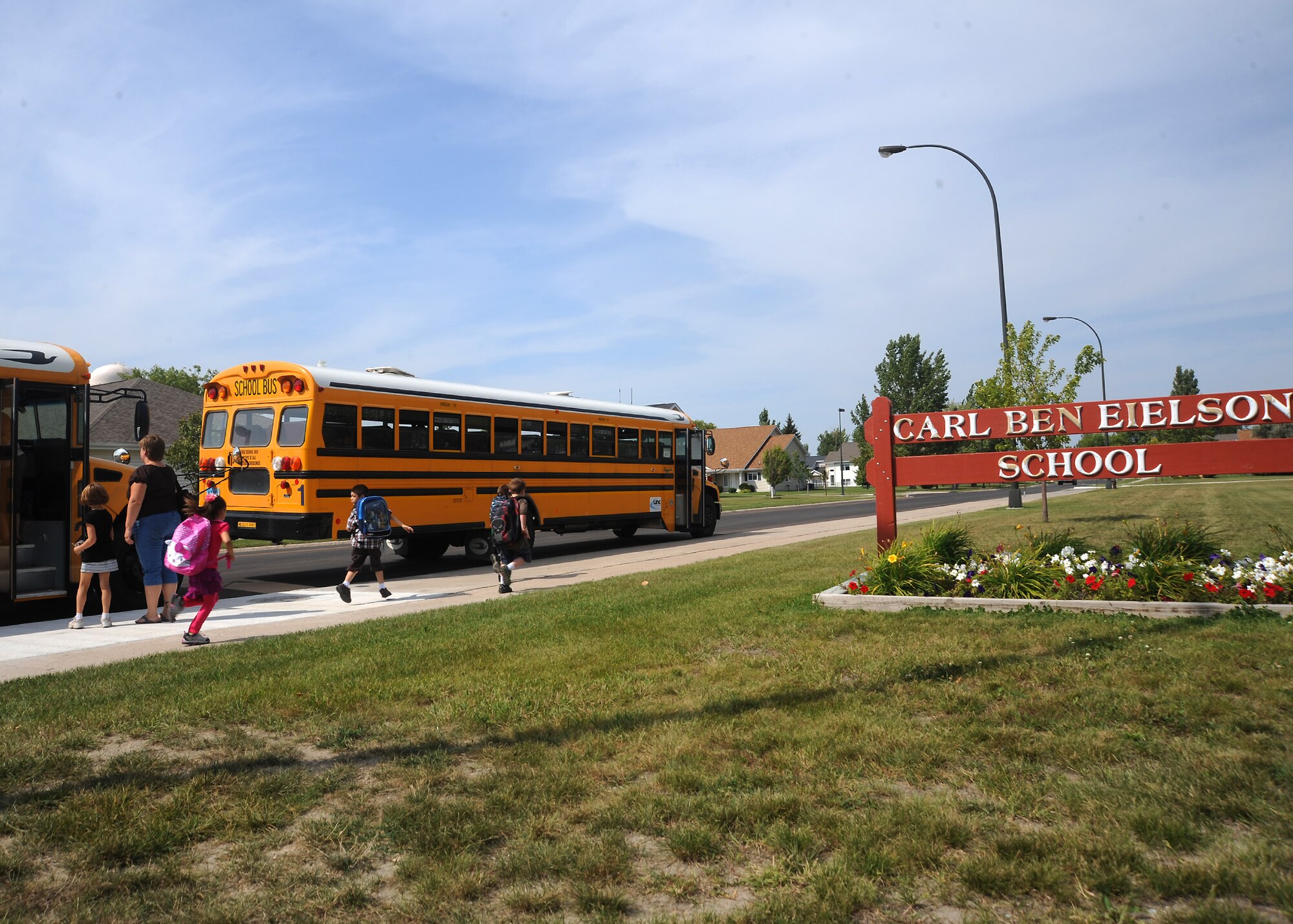 Students from Carl Ben Eielson Elementary School are dismissed after their first day of school Aug. 22, 2012, on Grand Forks Air Force Base, N.D. Approximately 600 military-affiliated students of the Grand Forks community returned to school this week.  (U.S. Air Force photo/Airman 1st Class Xavier Navarro)