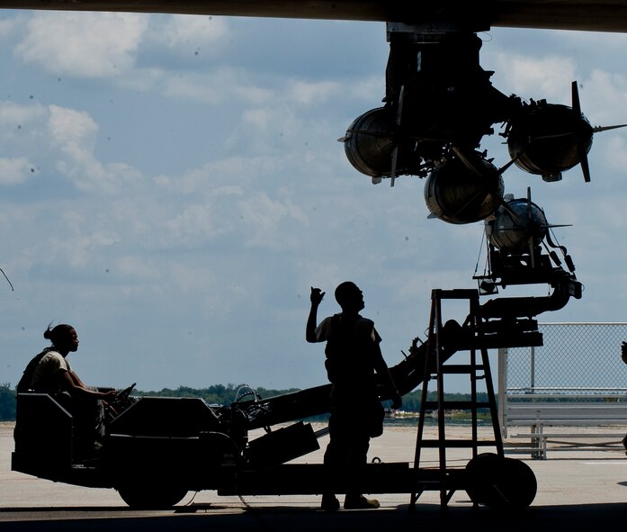 Members of the Global Strike Challenge nuclear/conventional load crew team lift a GBU-31 Joint Direct Attack Munition into position during a dry run leading up to the 2012 Air Force Global Strike Command Challenge on Barksdale Air Force Base, La., Aug. 20. The challenge consists of a variety of competitions designed to evaluate the various units under Air Force Global Strike Command, as well as the Air National Guard, Air Force Reserve Command and Air Combat Command. (U.S. Air Force photo/Staff Sgt. Chad Warren)(RELEASED)