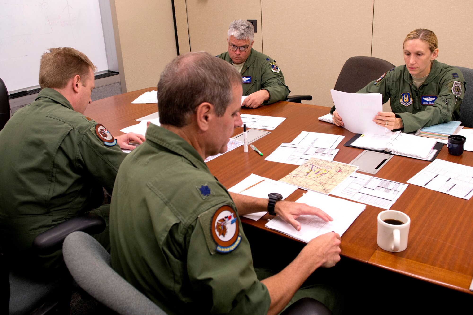 Aircrew members from the 93rd Bomb Squadron, prepare for a B-52 bombing training mission on Aug. 21, 2012, Barksdale Air Force Base, La. The mission is practice for the upcoming Global Strike Challenge competition and the competing aircrew members are Lt. Col. Steve Smith, radar navigator, Maj. Bryan Bailey, copilot, Lt. Col. Kurt McClure, navigator, Capt. Andrea McElvaine, pilot and aircraft commander, and Capt. Wayne Johnson (not pictured), electronic warfare officer. (U.S. Air Force photo by Master Sgt. Greg Steele/Released)