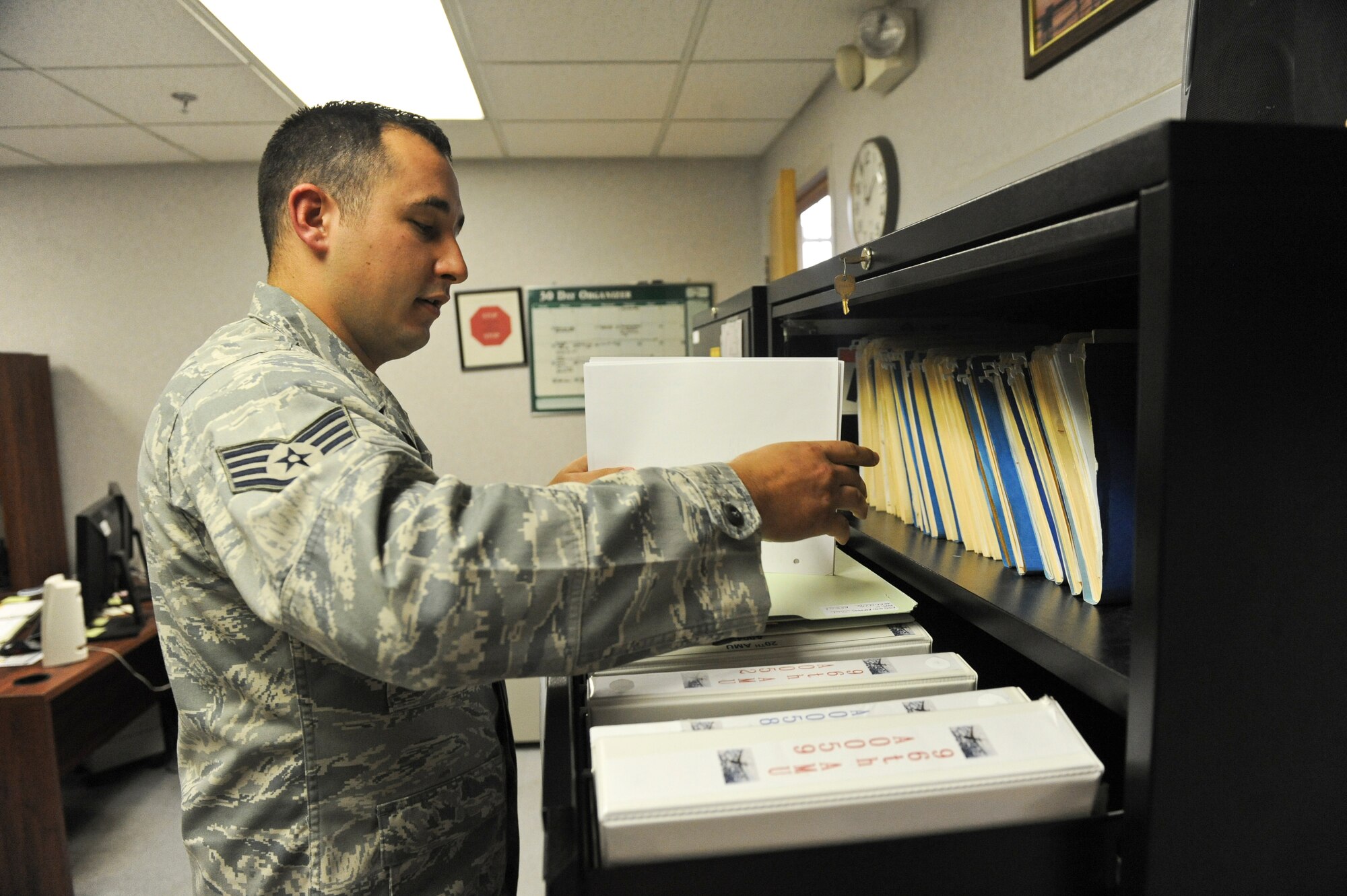 Staff Sgt. Joshua Crane, 2nd Maintenance Squadron assistant engine manager, goes through engine jacket files on Barksdale Air Force Base, La., Aug. 22. The files are used to keep track of the maintenance and inspection history of each engine. Once an engine has accumulated 6,000 hours of operation, the engine is shipped to the Maintenance Depot at Tinker AFB, Okla. (U.S. Air Force photo/Airman 1st Class Micaiah Anthony)(RELEASED)