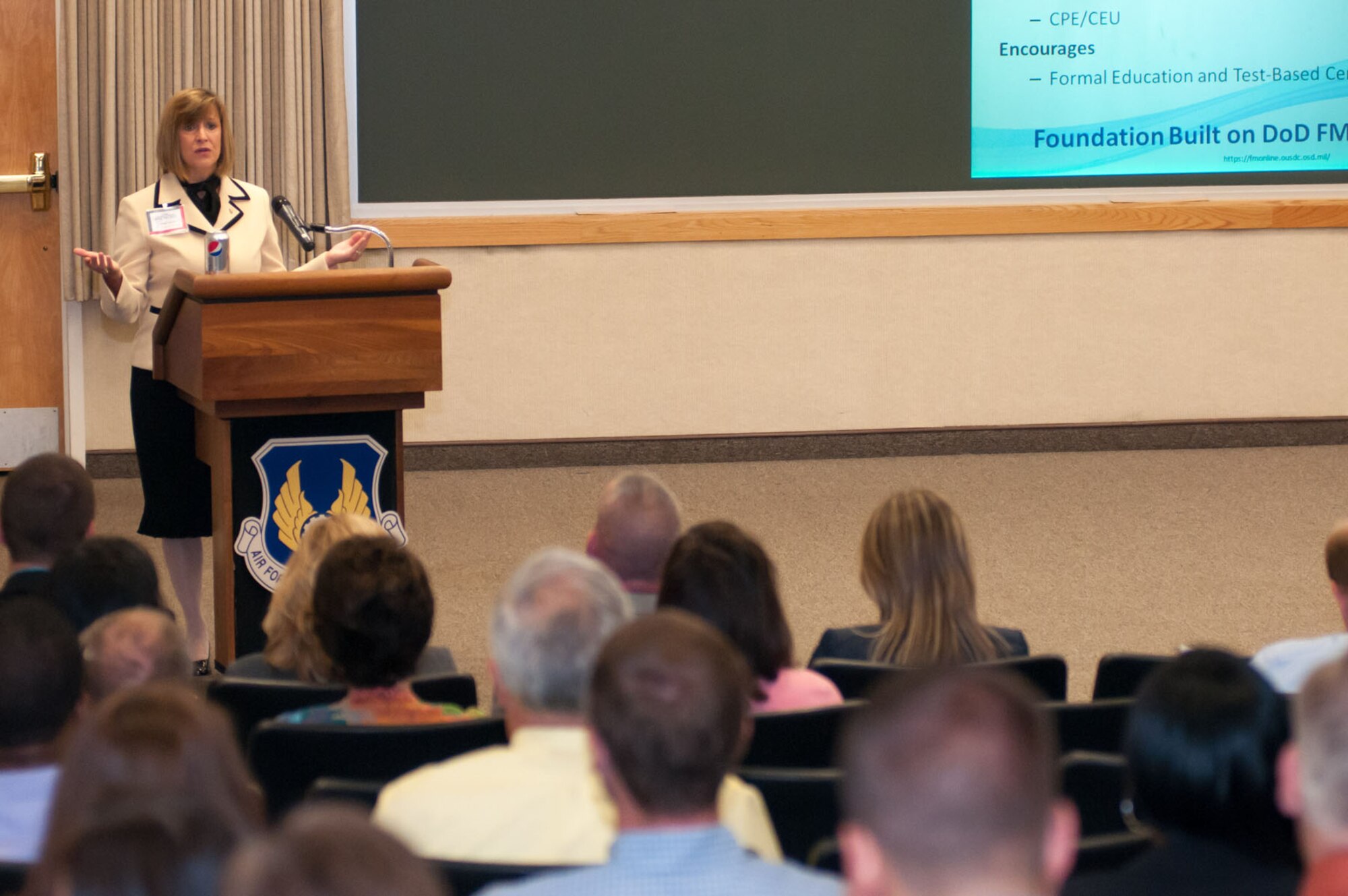 HANSCOM AIR FORCE BASE, Mass. - Glenda Scheiner, Human Capital and Resource Management director for the Office of the Undersecretary of Defense (Comptroller), speaks to attendees at a mini professional development event Aug. 16 at the Hanscom Conference Center. The event’s theme was “Strategic Professional Development within a Fiscally Constrained Environment” and it was hosted by the Yankee Chapter of the American Society of Military Comptrollers. (U.S. Air Force photo by Rick Berry) 