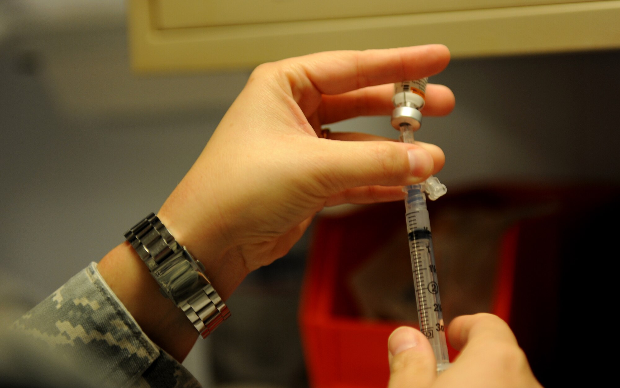Tech. Sgt. Kammy Fitzgerald, 39th Medical Operations Squadron NCO in charge of the allergy and immunizations section, fills a syringe before administering an immunization Aug. 22, 2012, at Incirlik Air Base, Turkey. The month of August is National Immunization Awareness Month, where medical professionals prepare for and inform people about the upcoming cold and flu season. Routine immunizations are important in saving lives since they prevent common but deadly diseases. (U.S. Air Force photo by Senior Airman Jarvie Z. Wallace/Released)