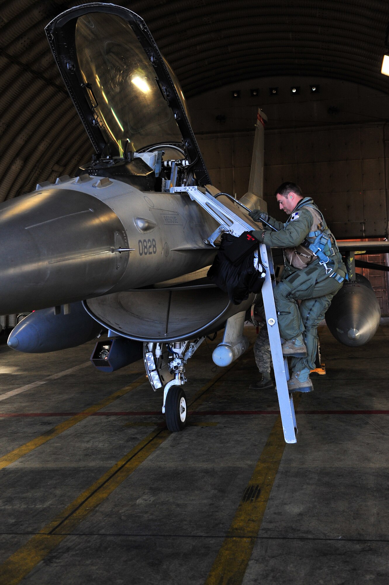 SPANGDAHLEM AIR BASE, Germany – Capt. Matthew Clayton, 480th Fighter Squadron pilot, climbs aboard an F-16 Fighting Falcon on the flight line here Aug. 23 before departing for Nordic Air Meet 2012. The fighter squadron departed for the multi-national training exercise to share and exchange new combat tactics with allied countries. (U.S. Air Force photo by Airman 1st Class Dillon Davis/Released)