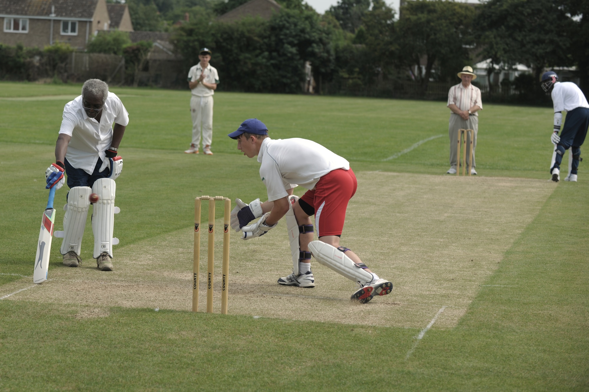 LONGSTANTON, United Kingdom – Cliff Walker, 423rd Air Base Group honorary commander and 423ADG cricket coach, scores a run for the ABG team during the first game played by the team Aug. 19 at Longstanton Bowls Club in Longstanton, United Kingdom. If the batsman is successful in striking the ball and the ball isn’t caught before it hits the ground, the two batsmen may then try to score points (runs) for their team by running across the pitch, grounding their bats behind each other's crease. Each crossing and grounding by both batsmen is worth one run. The batsmen may attempt multiple runs or elect not to run at all. By attempting runs, the batsmen risk dismissal, which can happen if the fielding team retrieves the ball and hits a wicket with the ball before either batsman reaches the opposite crease.  (U.S. Air Force photo by Master Sgt. John Barton)