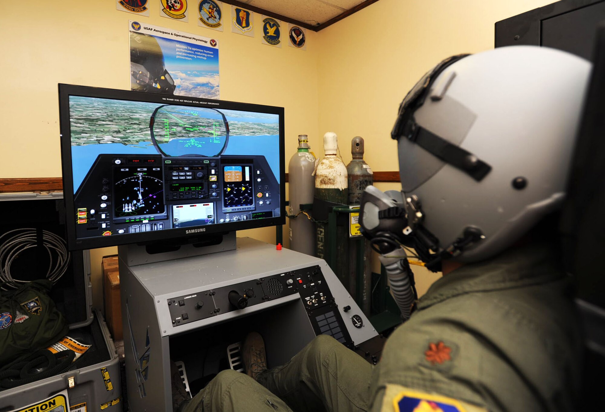 U.S. Air Force Maj. Robert Carden, 35th Operations Support Squadron chief of wing current operations, tests the Hypoxia Familiarization Trainer at Misawa Air Base, Japan, Aug. 21, 2012. Hypoxia is a condition where the human body cannot properly function due to a lack of oxygen, which causes the body to slow down until the pilot passes out. (U.S. Air Force photo by Airman 1st Class Kenna Jackson/Released)