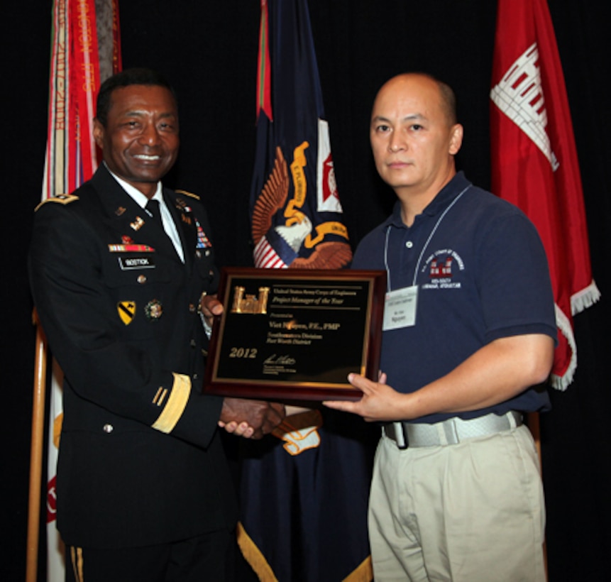 Lt. Gen. Thomas P. Bostick, left, commanding general of the U.S. Army Corps of Engineers, presents the Corps of Engineers Project Manager of the Year to Mr. Viet Nguyen, Fort Worth District




