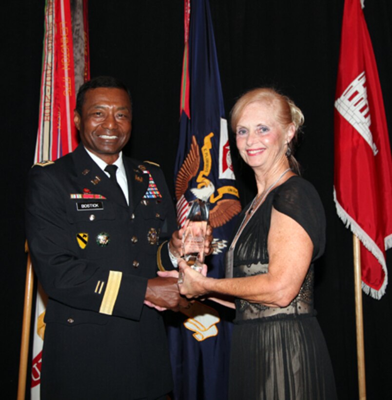 Lt. Gen. Thomas P. Bostickl, commanding general of the U.S. Army Corps of Engineers, presents the Ronald J. Ruffennach Communicator of the Year to Kristin Brown, Galveston District, U.S. Army Corps of Engineers

