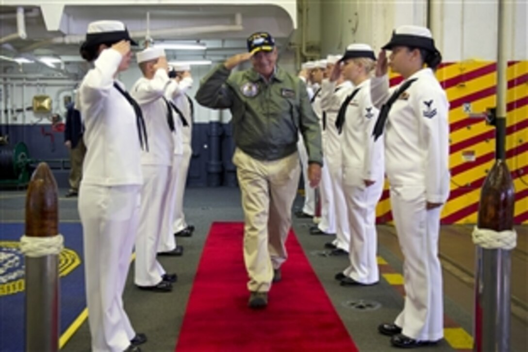 Sailors pipe Defense Secretary Leon E. Panetta aboard the USS John C. Stennis in Bremerton, Wash., Aug. 22, 2012. The John C. Stennis Carrier Strike Group is scheduled to deploy at the end of the month to the U.S. 5th Fleet area of responsibility.