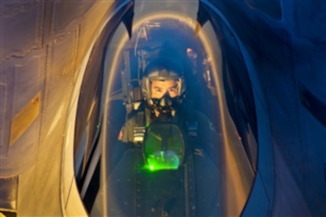An F-22 Raptor pilot flies behind a KC-135 Stratotanker aircraft after an air refueling mission to support the Brooklyn Cyclone flyover during Air Force Week in New York, Aug. 21, 2012. The pilot is assigned to Tyndall Air Force Base, Fla., and the aircraft crew is assigned to Altus Air Force Base, Okla.